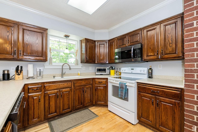 5883 S Jared Way E, South Ogden, UT 84403 - kitchen with stainless steel microwave, white electric range oven, light wood-type flooring, light countertops, and crown molding
