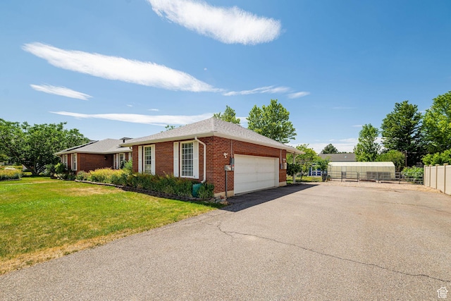 5883 S Jared Way E, South Ogden, UT 84403 - view of side of property with an attached garage, brick siding, and driveway