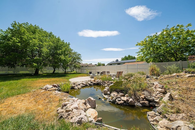 5883 S Jared Way E, South Ogden, UT 84403 - fenced backyard featuring a garden pond