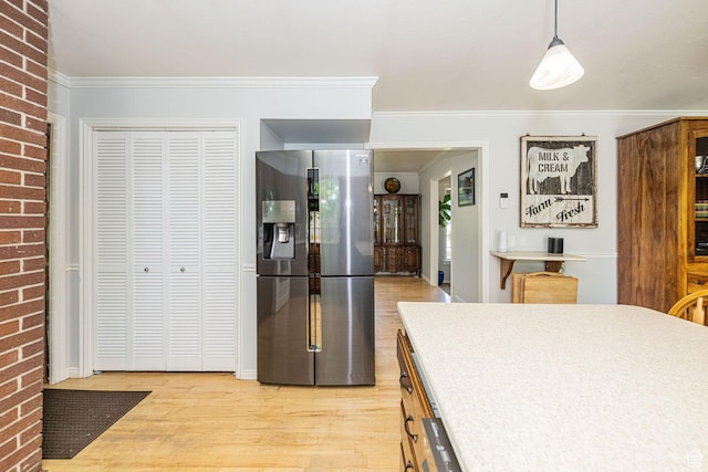 5883 S Jared Way E, South Ogden, UT 84403 - kitchen with stainless steel refrigerator with ice dispenser, light wood-style floors, ornamental molding, and pendant lighting