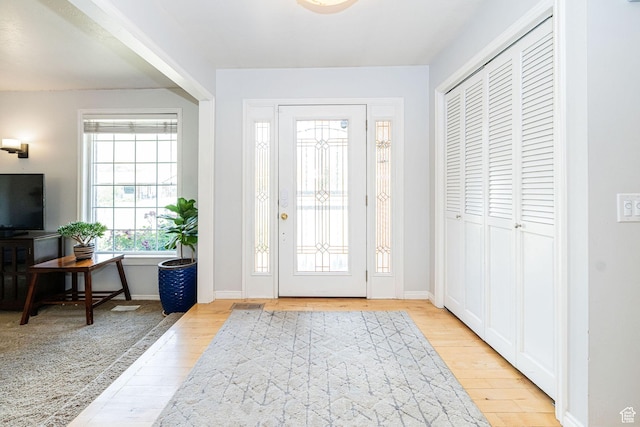 5883 S Jared Way E, South Ogden, UT 84403 - foyer entrance with wood finished floors and baseboards