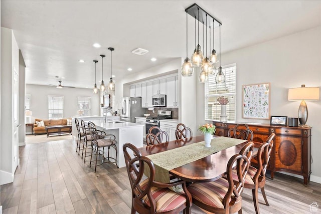 5328 W S Jordan Pkwy S, South Jordan, UT 84009 - dining space with light wood-style flooring, recessed lighting, and ceiling fan