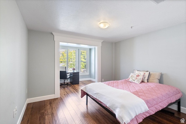 3075 E Kennedy Dr Unit 315, Salt Lake City, UT 84108 - bedroom featuring a desk and wood finished floors