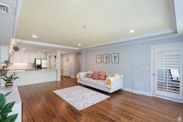 3075 E Kennedy Dr Unit 315, Salt Lake City, UT 84108 - living room featuring dark wood-type flooring, recessed lighting, and a tray ceiling