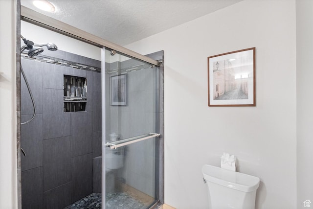 3075 E Kennedy Dr Unit 315, Salt Lake City, UT 84108 - bathroom with a stall shower and a textured ceiling