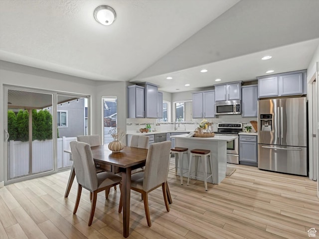 2296 S 2040 W, Woods Cross, UT 84087 - dining room with lofted ceiling, light wood finished floors, and recessed lighting