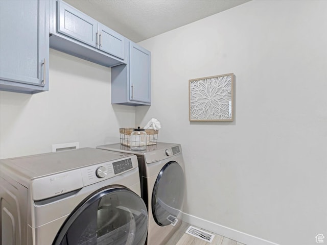 2296 S 2040 W, Woods Cross, UT 84087 - laundry room featuring cabinet space and washer and dryer