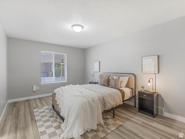 2296 S 2040 W, Woods Cross, UT 84087 - bedroom with light wood-type flooring and baseboards