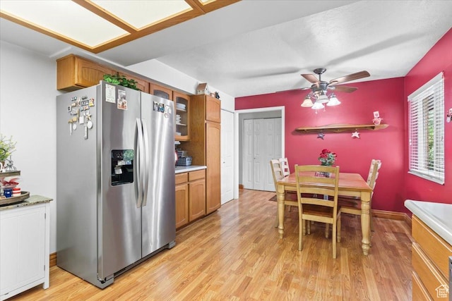 388 S Golden Circle Dr E, Fruit Heights, UT 84037 - kitchen with stainless steel refrigerator with ice dispenser, light wood-type flooring, brown cabinets, and light countertops