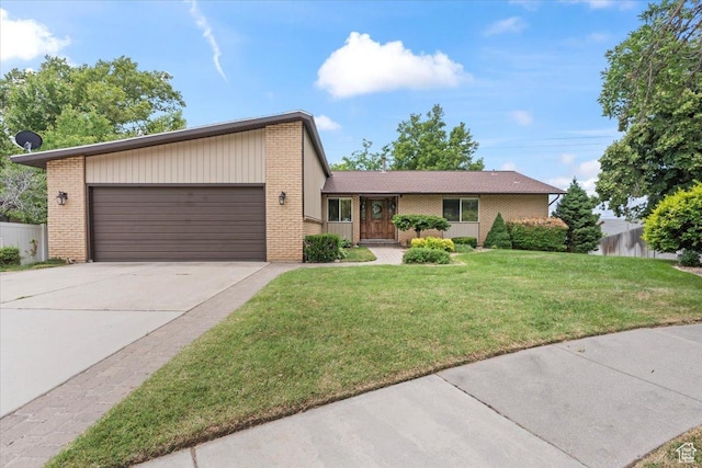 388 S Golden Circle Dr E, Fruit Heights, UT 84037 - view of front of house with a garage, brick siding, and driveway