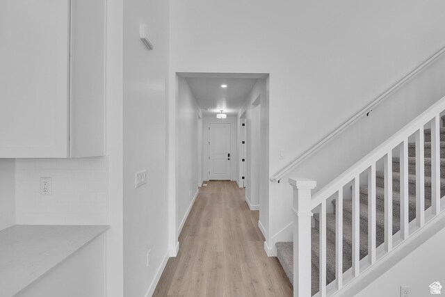1089 S 3170 E Unit 205, Spanish Fork, UT 84660 - hallway featuring light wood-type flooring and stairway