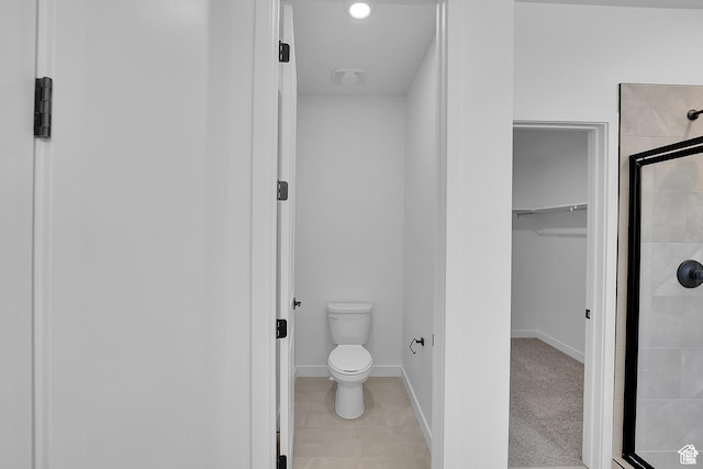 1089 S 3170 E Unit 205, Spanish Fork, UT 84660 - bathroom with a shower stall, a spacious closet, and tile patterned flooring