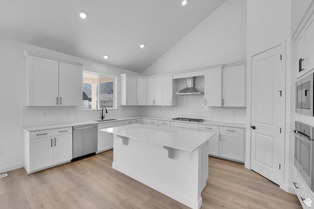 1089 S 3170 E Unit 205, Spanish Fork, UT 84660 - kitchen featuring stainless steel appliances, wall chimney exhaust hood, white cabinets, decorative backsplash, and recessed lighting