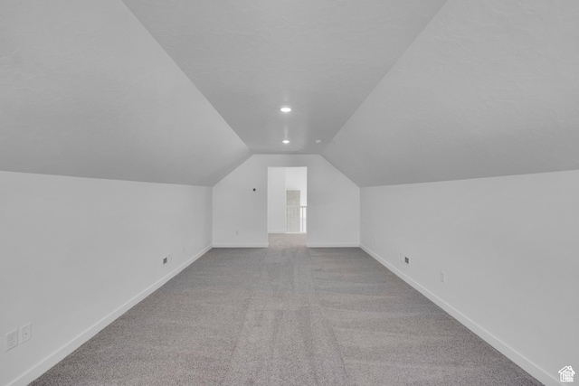 1089 S 3170 E Unit 205, Spanish Fork, UT 84660 - additional living space with lofted ceiling, carpet floors, and recessed lighting
