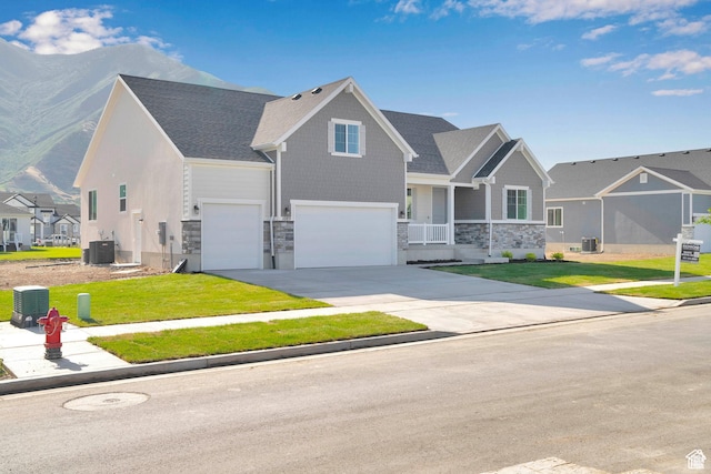 1089 S 3170 E Unit 205, Spanish Fork, UT 84660 - craftsman inspired home with stone siding, an attached garage, a front yard, and driveway