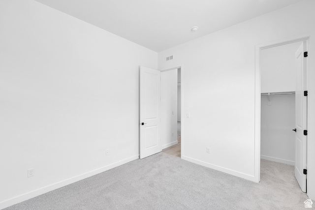 1147 S 3170 E Unit 207, Spanish Fork, UT 84660 - unfurnished bedroom featuring light carpet, a spacious closet, and a closet