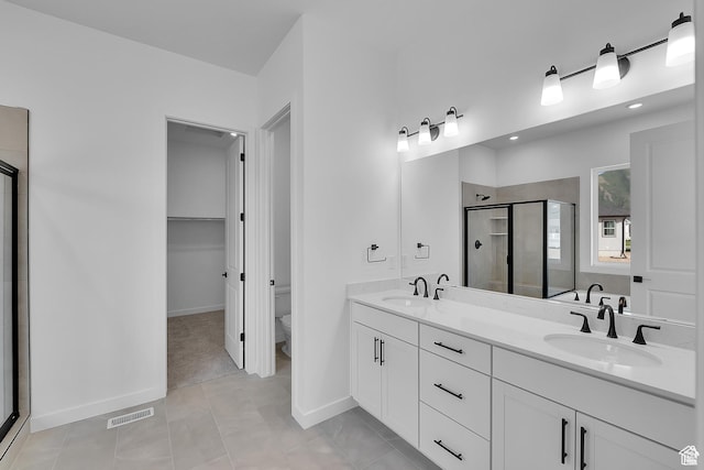 1147 S 3170 E Unit 207, Spanish Fork, UT 84660 - bathroom featuring a stall shower, double vanity, and recessed lighting