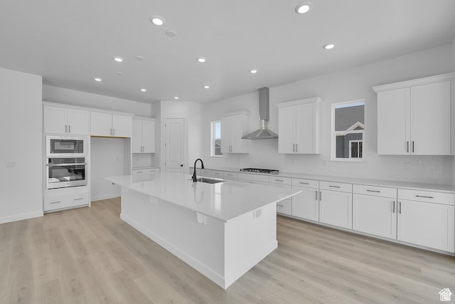 1147 S 3170 E Unit 207, Spanish Fork, UT 84660 - kitchen featuring stainless steel appliances, white cabinetry, wall chimney exhaust hood, and recessed lighting
