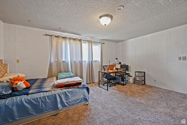 308 W 1050 N, Logan, UT 84321 - bedroom featuring carpet floors, a textured ceiling, and an office area