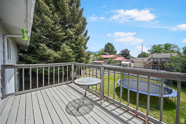 308 W 1050 N, Logan, UT 84321 - wooden terrace with a trampoline, a residential view, and a lawn