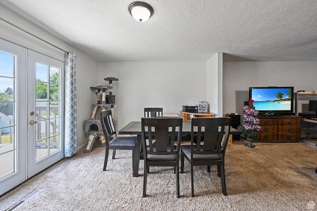 308 W 1050 N, Logan, UT 84321 - dining room featuring carpet, a textured ceiling, and french doors