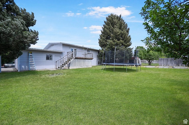 308 W 1050 N, Logan, UT 84321 - view of yard with stairs, a trampoline, and a deck