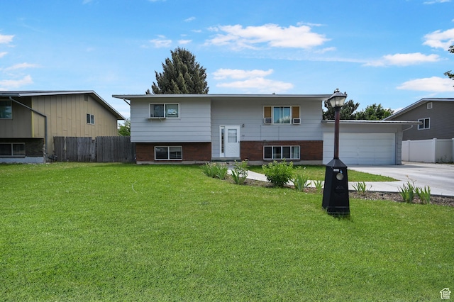 308 W 1050 N, Logan, UT 84321 - split foyer home featuring a garage and concrete driveway