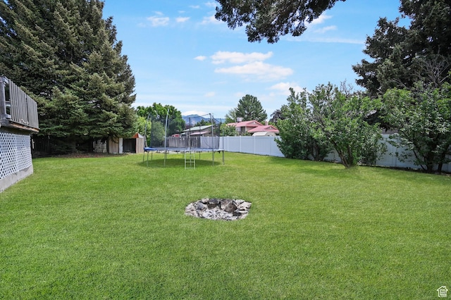 308 W 1050 N, Logan, UT 84321 - fenced backyard with a trampoline and a storage unit