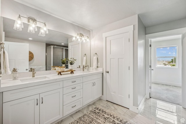 4269 W 2025 S, West Haven, UT 84401 - bathroom with double vanity, a shower stall, and marble finish floors