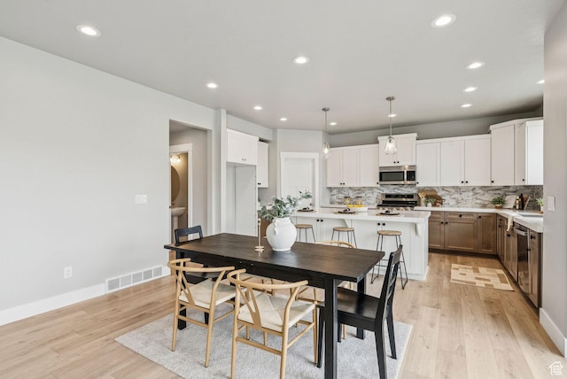 4269 W 2025 S, West Haven, UT 84401 - dining space featuring light wood-style flooring and recessed lighting