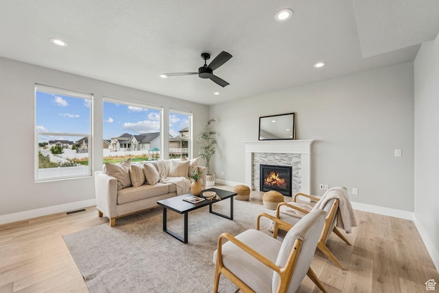 4269 W 2025 S, West Haven, UT 84401 - living room with ceiling fan, a stone fireplace, light wood-type flooring, and recessed lighting
