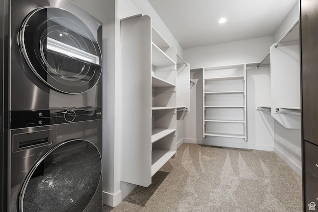 3071 N Mountain Rd Unit 4, North Ogden, UT 84414 - washroom with estacked washer and dryer and carpet floors