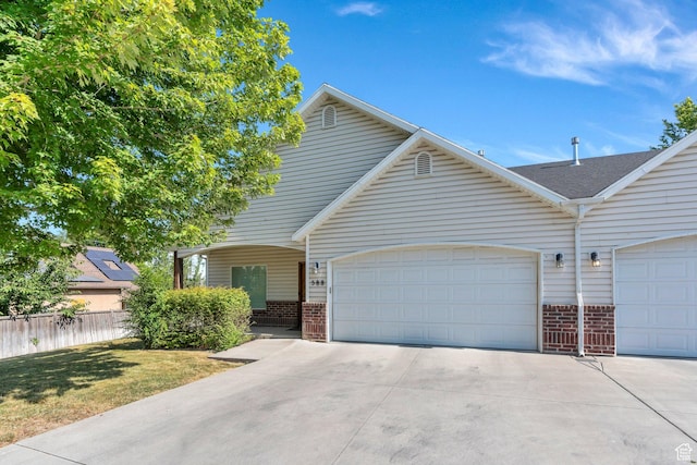 588 S 350 E, Pleasant Grove, UT 84062 - multi unit property with brick siding, concrete driveway, an attached garage, and a shingled roof
