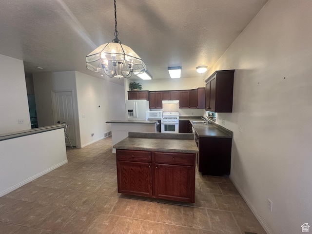 560 E 700 N, Logan, UT 84321 - kitchen with white appliances, a chandelier, dark countertops, a kitchen island, and a textured ceiling