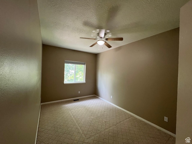560 E 700 N, Logan, UT 84321 - carpeted spare room featuring ceiling fan and a textured ceiling