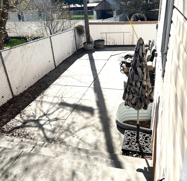 560 E 700 N, Logan, UT 84321 - fenced backyard featuring a patio area
