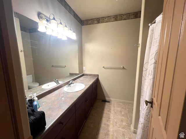 560 E 700 N, Logan, UT 84321 - full bathroom with vanity and tile patterned flooring