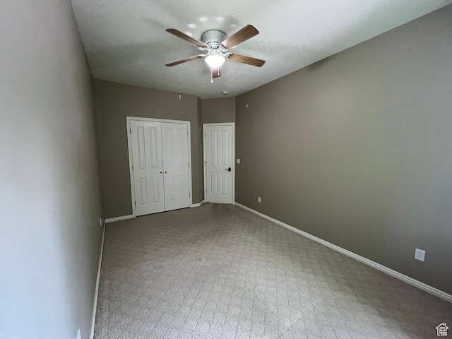 560 E 700 N, Logan, UT 84321 - unfurnished bedroom featuring a closet, carpet floors, and a ceiling fan