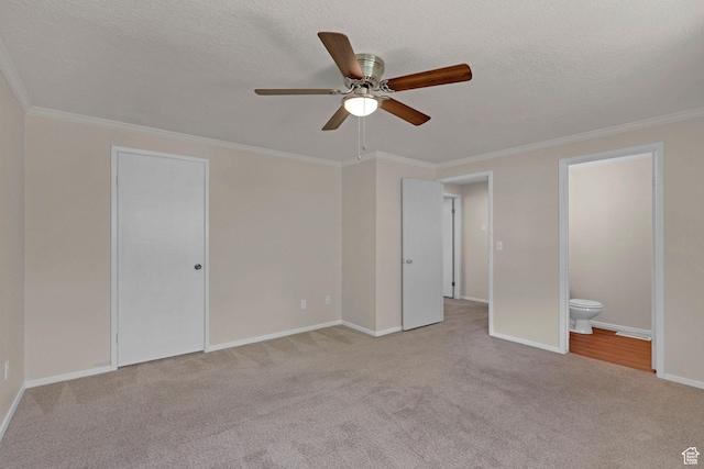 192 N Highland Blvd, Brigham City, UT 84302 - unfurnished bedroom featuring carpet floors, ornamental molding, a textured ceiling, connected bathroom, and ceiling fan