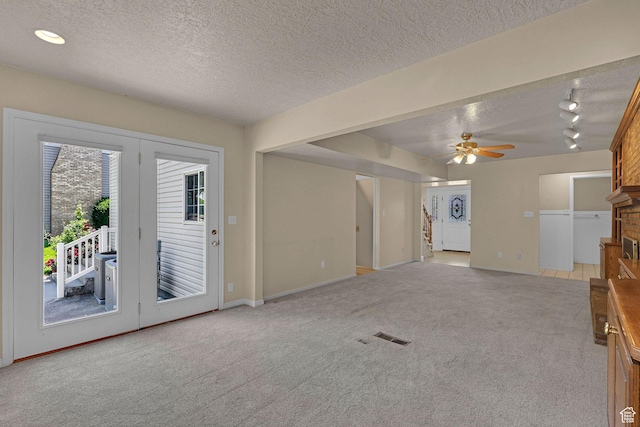 192 N Highland Blvd, Brigham City, UT 84302 - unfurnished living room featuring light carpet, a textured ceiling, ceiling fan, and rail lighting