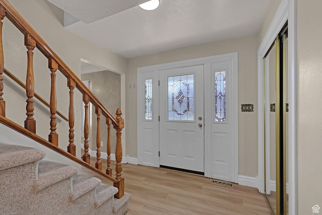 192 N Highland Blvd, Brigham City, UT 84302 - entrance foyer featuring light wood finished floors and stairway