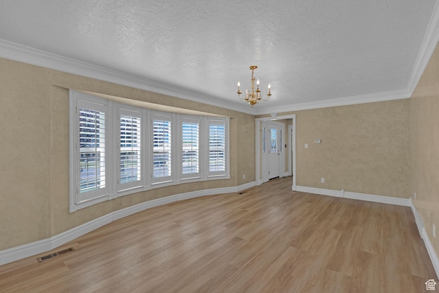 192 N Highland Blvd, Brigham City, UT 84302 - unfurnished room with a chandelier, light wood finished floors, a textured ceiling, and crown molding