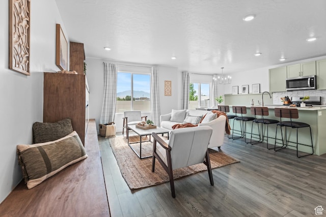 356 N Starboard Ln Unit 1555, Saratoga Springs, UT 84045 - living room with a chandelier, dark wood-type flooring, and recessed lighting