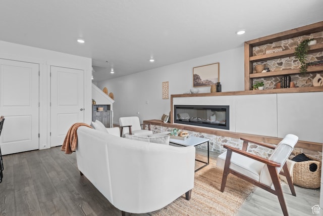 356 N Starboard Ln Unit 1555, Saratoga Springs, UT 84045 - living area featuring a glass covered fireplace, wood finished floors, and recessed lighting