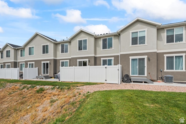 356 N Starboard Ln Unit 1555, Saratoga Springs, UT 84045 - rear view of house featuring stucco siding and a gate