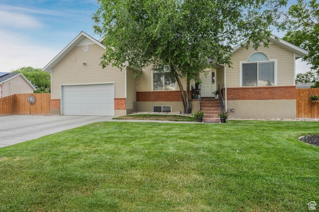 3561 S Jenelles Bay, West Valley City, UT 84119 - view of front of house featuring concrete driveway, a garage, and brick siding