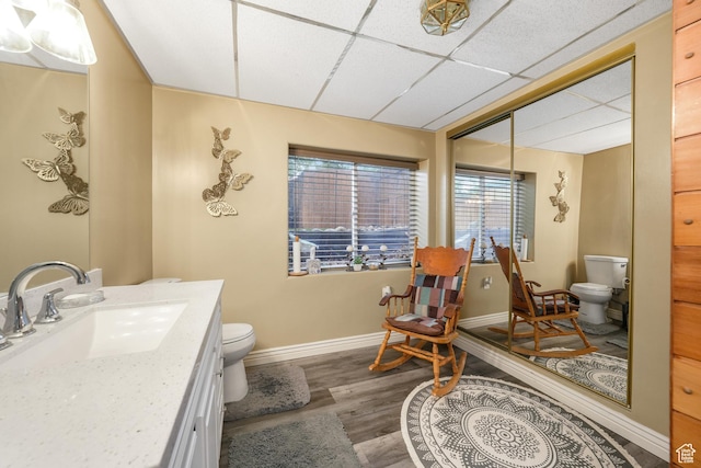 3561 S Jenelles Bay, West Valley City, UT 84119 - bathroom with vanity, a paneled ceiling, and wood finished floors