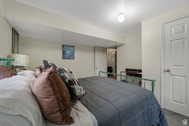 3561 S Jenelles Bay, West Valley City, UT 84119 - carpeted bedroom featuring a textured ceiling
