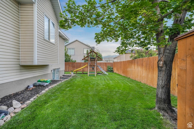 3561 S Jenelles Bay, West Valley City, UT 84119 - fenced backyard featuring a playground