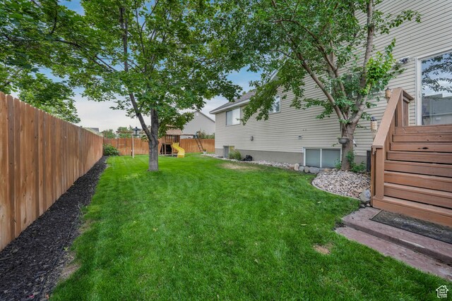 3561 S Jenelles Bay, West Valley City, UT 84119 - fenced backyard with a playground